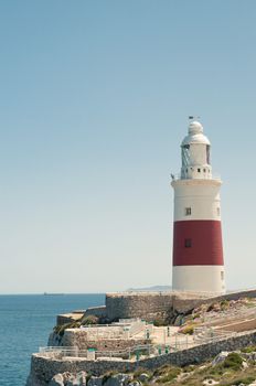 Lighthouse in Gibraltar, blue sky and sea