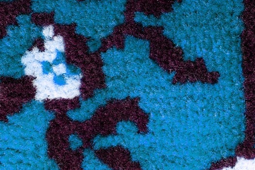 Hand woven carpet pattern, close up view