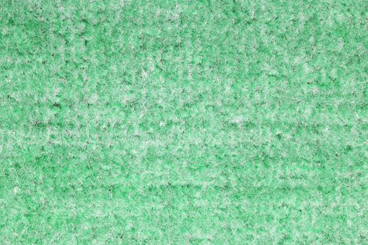 Background of green carpet or foot scraper