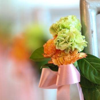 Closeup bouquet carnation flowers and pink ribbon