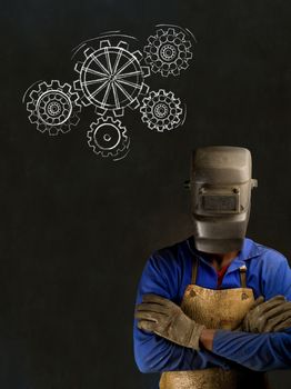 African American black man industrial worker with chalk gears on a blackboard background