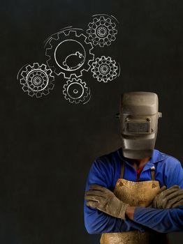 African American black man industrial worker with chalk hamster gears on a blackboard background