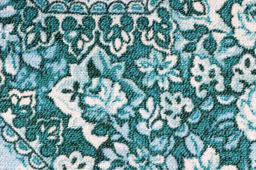 Fragment of colorful retro tapestry textile pattern with floral ornament useful as background