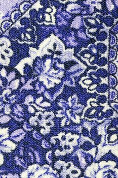 Fragment of colorful retro tapestry textile pattern with floral ornament useful as background