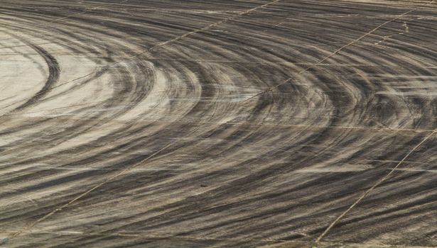 Background with tire marks on road track