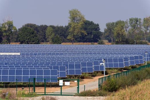 large solar panel system installed on an open field