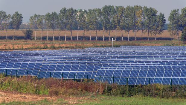 large solar panel system installed on an open field