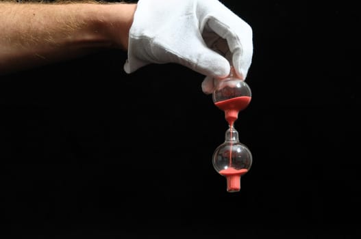 Clock And an Hand on a Black Background