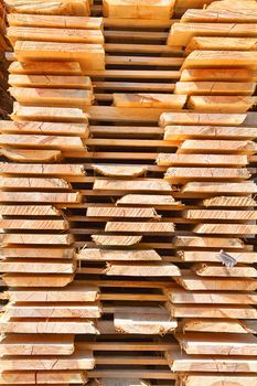 Stack of new wooden studs at the lumber yard