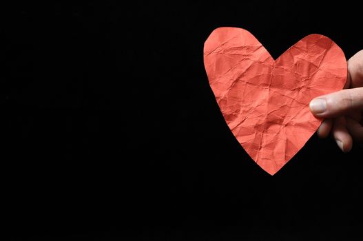 Heart And an Hand on a Black Background