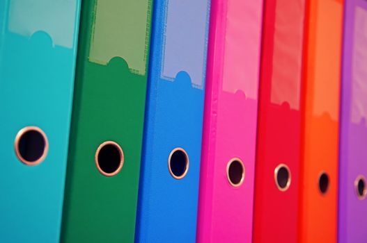 Colorful office folders on the bookshelf