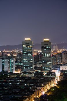 Urban scenery with skyscrapers and apartments in night, Taipei, Taiwan.