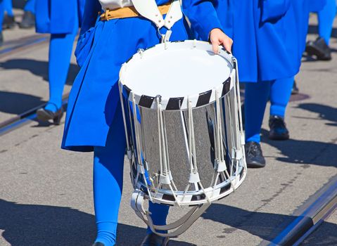 Drum in the hands of the musician on the street parade