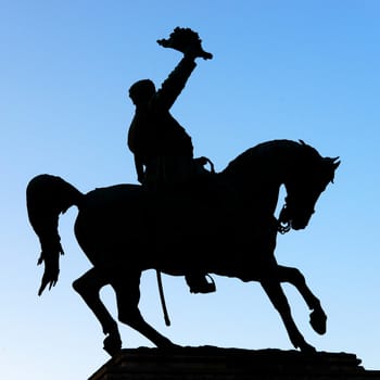 knight saluting with hat and riding