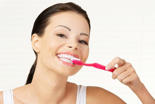 Woman with great teeth holding tooth brush
