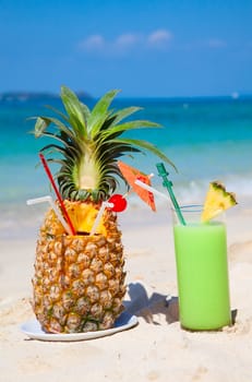 Fresh fruit cocktail on a tropical island beach