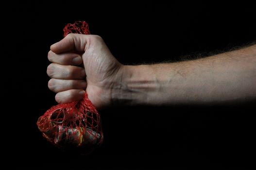 Trapped Money And an Hand on a Black Background