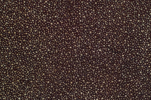 Texture of dark cloth with silver and blue sequins as background