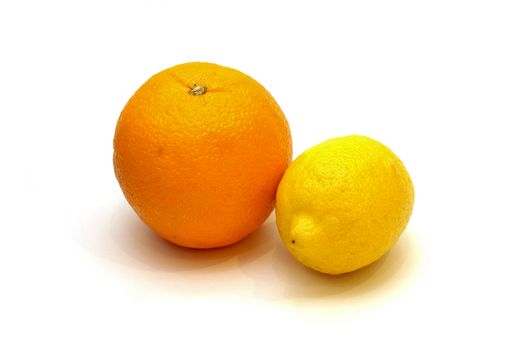 Lemon and orange isolated on white