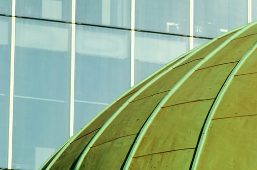 Green Copper Dome of Church with Windows of Office Block