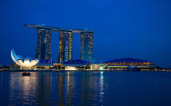 SINGAPORE - FEBRUARY 23: The Marina Bay Sands complex at night on February 23, 2013 in Singapore. Marina Bay Sands is an integrated resort and billed as the world's most expensive standalone casino property.