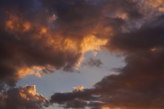 Clouds in the rays of the setting sun