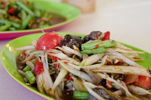 close up spicy papaya salad with crab and vegetable , very spicy