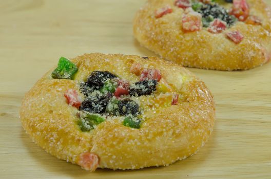close up sweet   bread with sugar ,  raisin and  dried fruits  