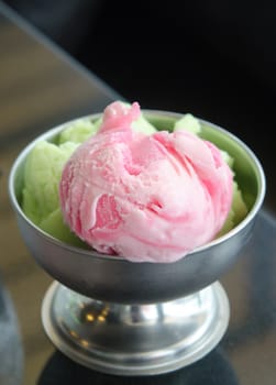 close up strawberry ice cream  and green tea ice cream in  bowl