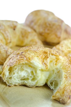 close up croissants on wooden plate ,  on white background , fresh bread