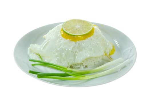 steamed  rice and fried egg with fresh green vegetable on white 