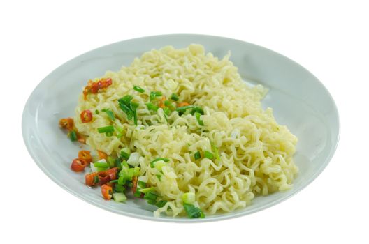 close up cooked instant noodles with chili and vegetable on dish over  white background