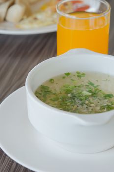 close up Rice soup with mince pork and vegetable in white bowl