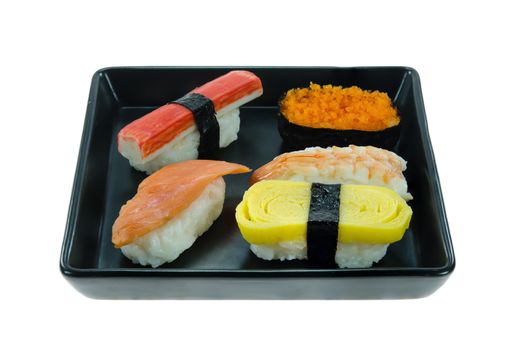 Japanese sushi set , mix sushi rolls on black plate over white background