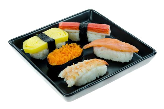 Japanese  sushi set on black dish over white