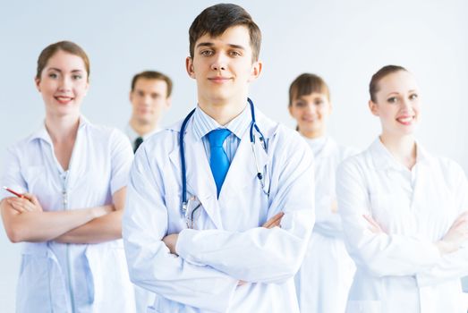 team of experienced highly qualified doctors, fold one's arms