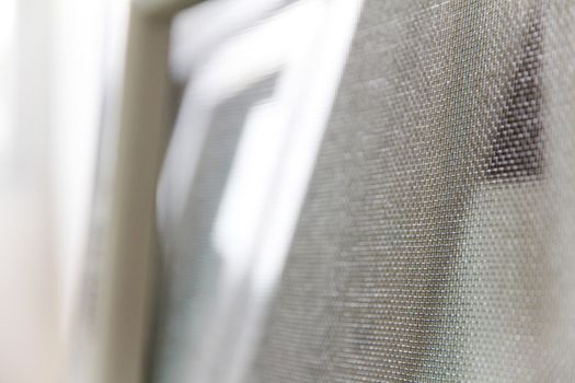 close up of mosquito net and window background