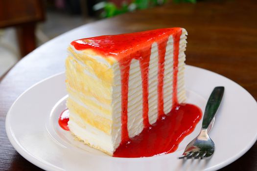 Homemade Crepe cake with strawberry sauce