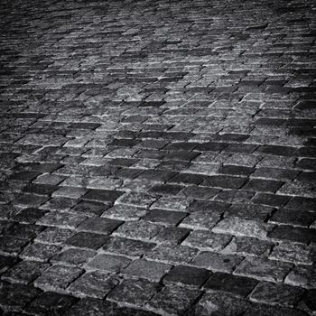 Cobbles abstract monochrome background.