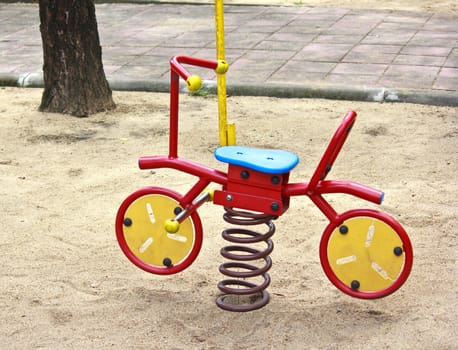 toy bicycle at a playground in Thailand

