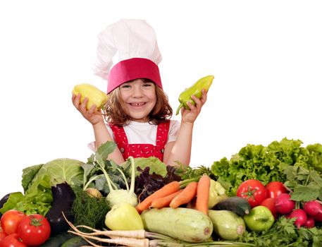 happy little girl cook with peppers and vegetables