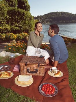 Happy peope together in a picnic outdoors 