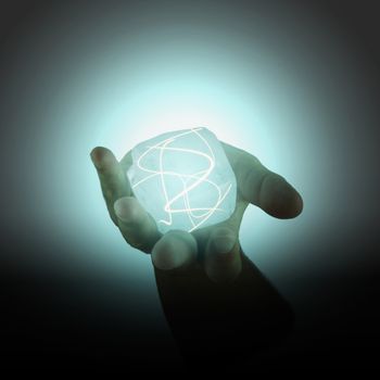 Power cube with lights held in a male hand