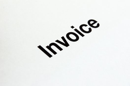 Text the invoices billing on white paper.