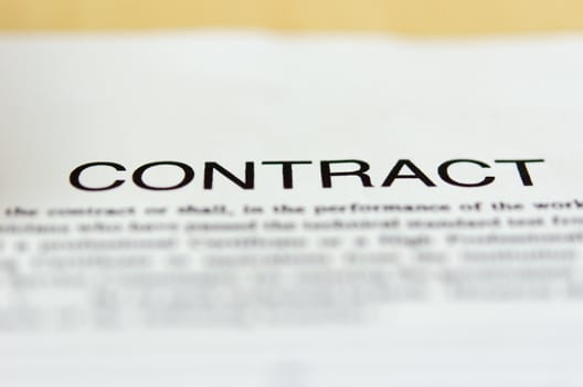 Detail of a contract document on table.