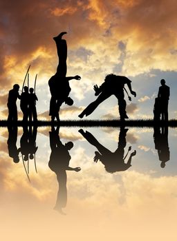 Capoeira silhouette at sunset