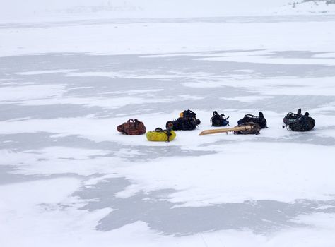 tourist backpacks in the winter on ice