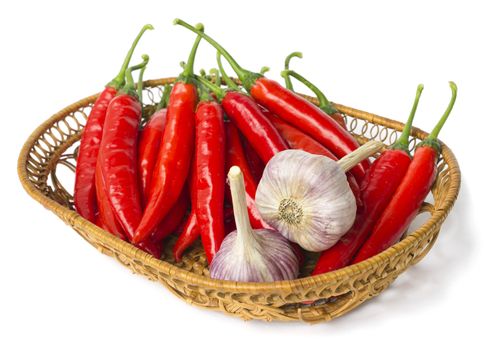 Red pepper and garlic in a straw bowl