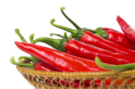 Lot of hot pepper in a straw dish