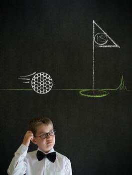 Scratching head thinking boy dressed up as business man with chalk golf ball flag green on blackboard background